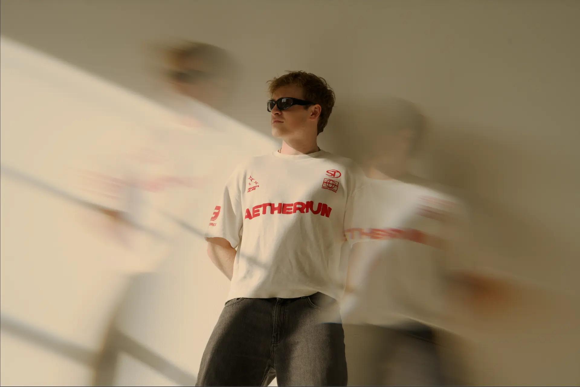 JAMØ wearing sunglasses in a motion-blurred portrait